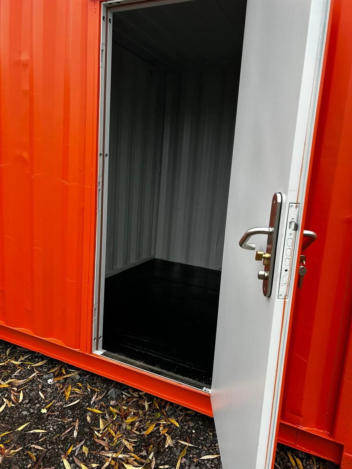 40ft Multi-Compartment Shipping Container – Individual Side Access – open personnel door revealing empty container storage compartment