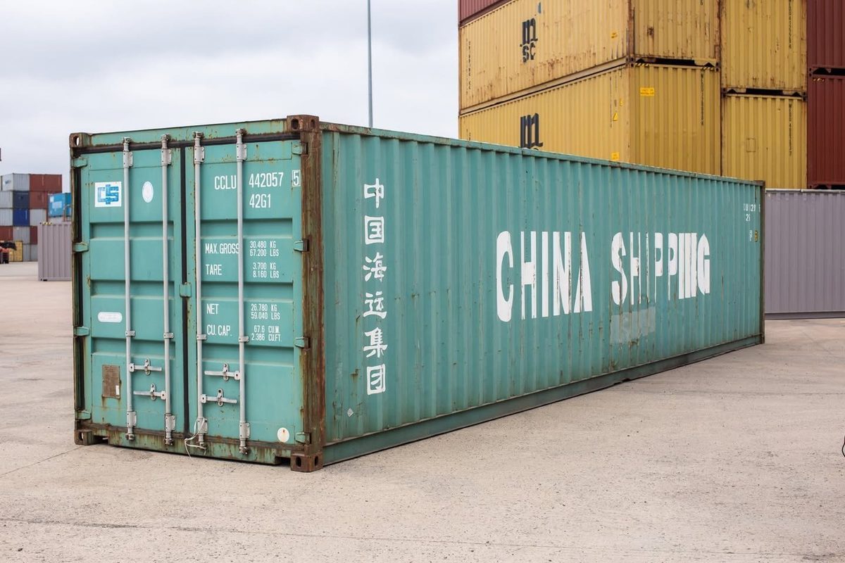 40ft Used Shipping Container – Wind & Watertight Storage – three-quarter exterior view of weathered container with cargo doors closed