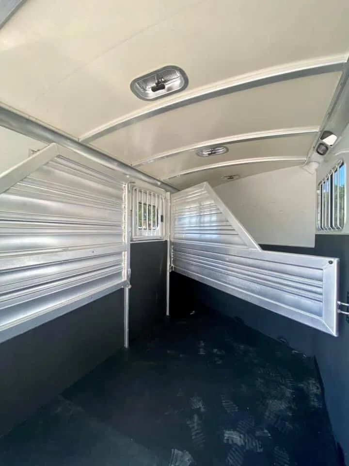 2011 Cimarron 3 Horse Bumper Pull – Insulated Roof – Wide interior shot of horse area showing dividers and windows