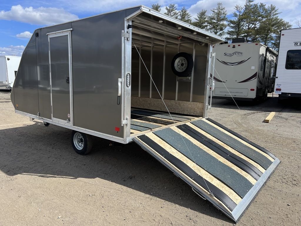 2023 Sno Pro 2-Place Snowmobile Trailer – Galvanized Package – Open rear ramp door leading into the wood-lined interior with guides