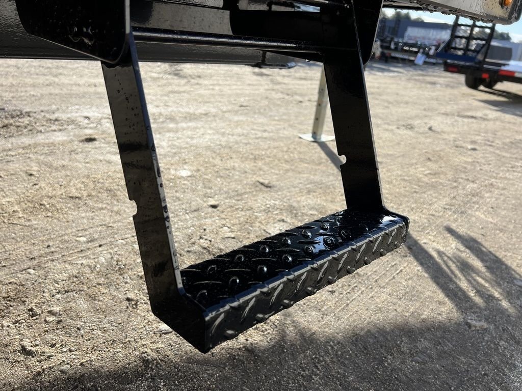 2024 Diamond C 22 ft Deckover Trailer – Slide-In Ramps – Close-up of a black diamond-plate side step mounted on the frame