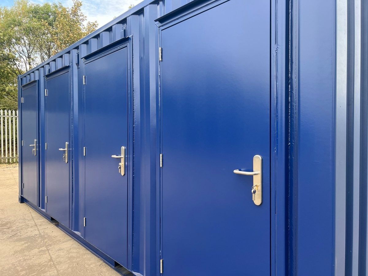 20ft New Shipping Container – Four-Door Storage Configuration – angled view of four blue storage compartment doors
