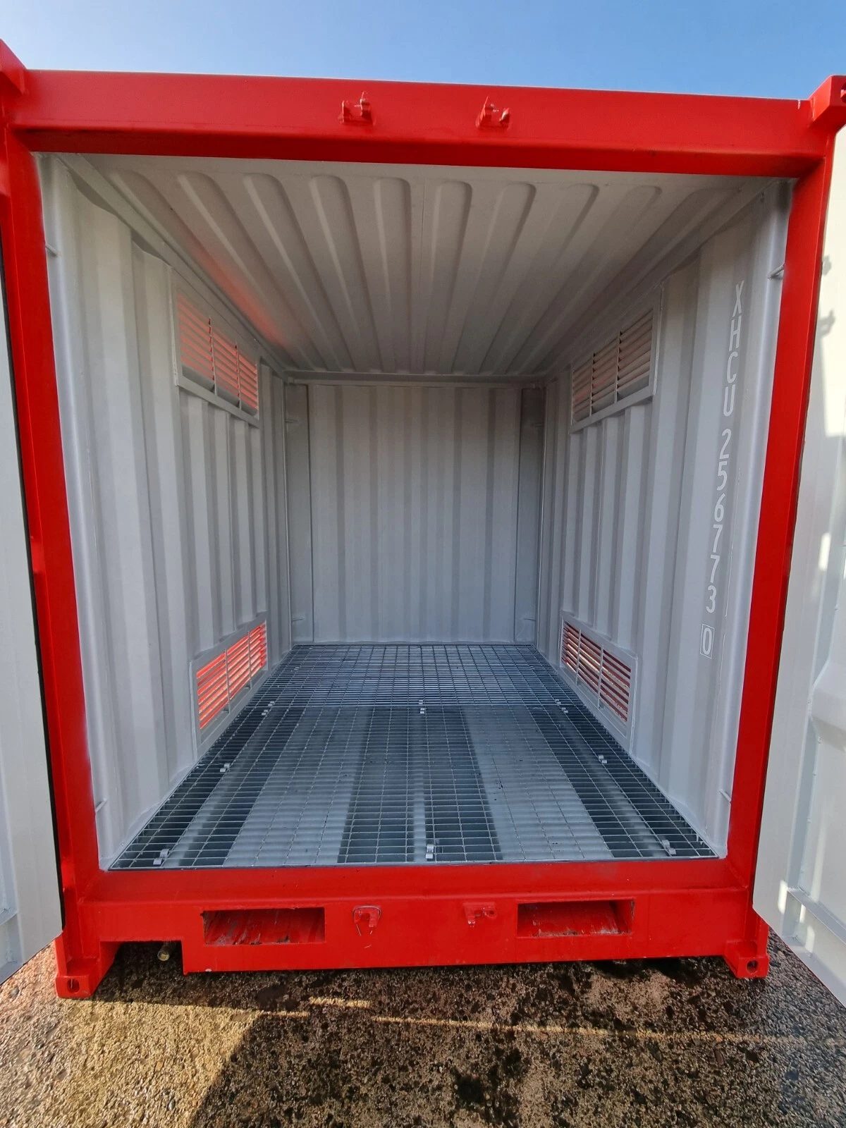 9ft Hazardous Goods Storage Container – Integrated Spill Sump – empty ventilated container interior with steel grating floor