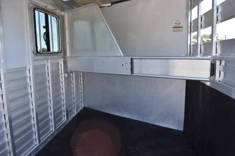 2014 Sundowner 2 Horse Gooseneck Trailer – Electric Jack – Interior horse stall area showing aluminum dividers and rubber flooring