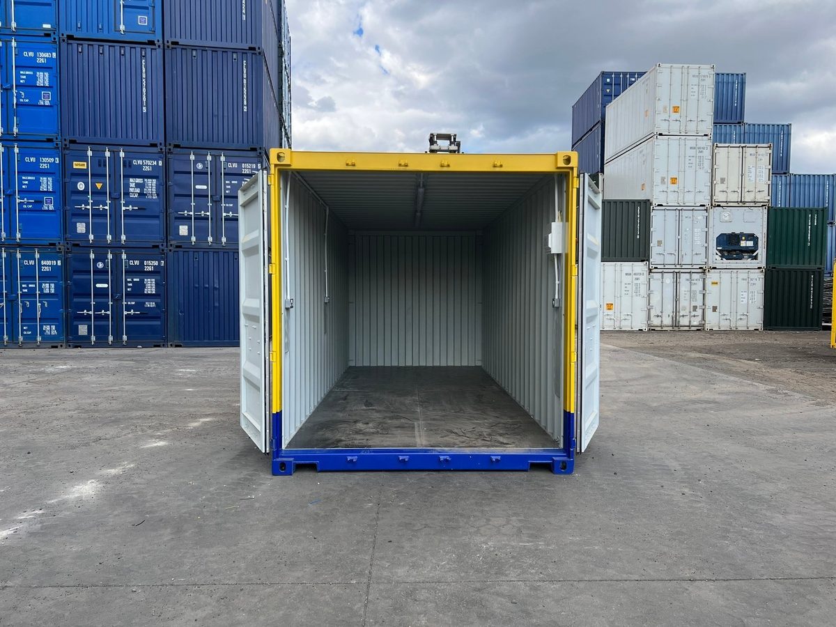 20ft One-Trip Modified Shipping Container – Electrical and LEDs – open cargo doors revealing empty container in storage yard