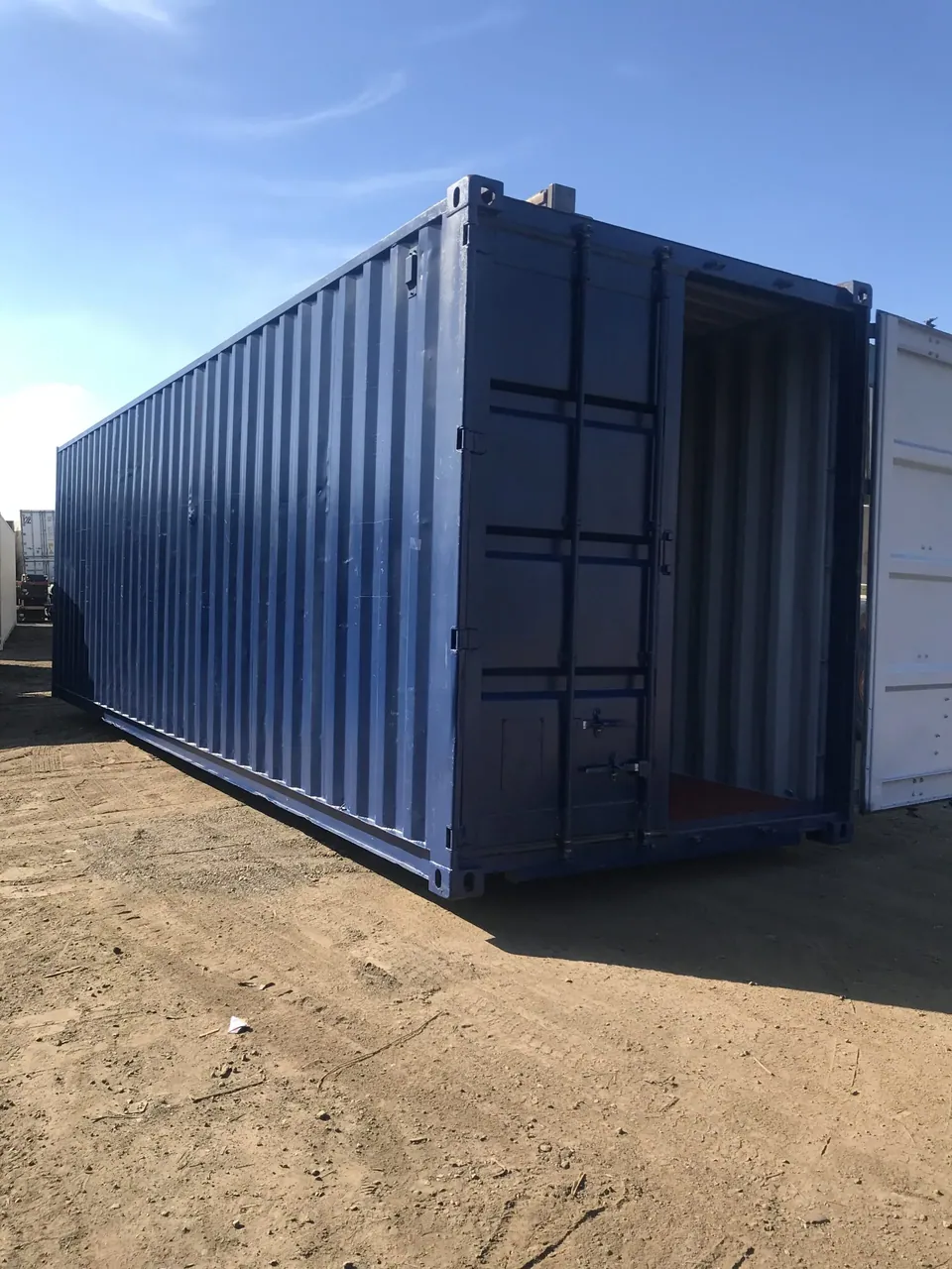 30ft Modified Storage Container – Roll-Up Access – three-quarter exterior view of container with one cargo door open