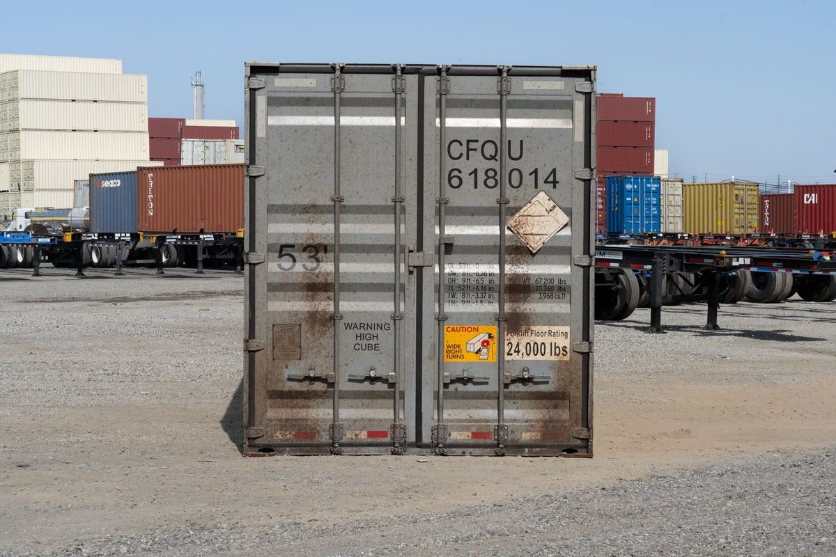 53ft High Cube Shipping Container – Used, Cargo Worthy – straight-on view of weathered container with cargo doors closed