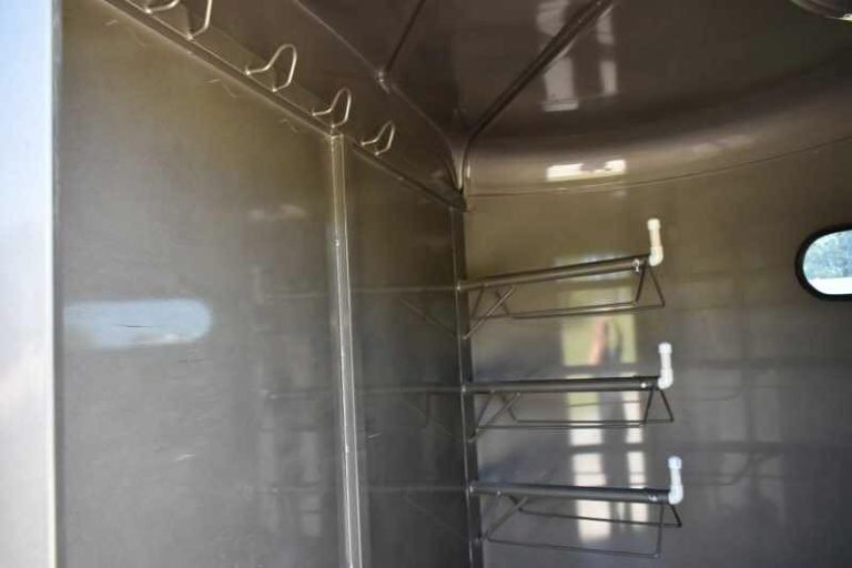 2017 CM 3HSLBP 3 Horse Trailer – Galvanneal, Dressing Room – Interior view of the tack room showing bridle hooks and saddle racks