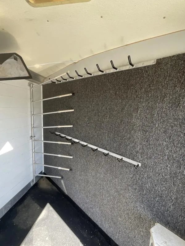 2005 Jamco 4 Horse Gooseneck Trailer – Blue, Air Suspension – Carpeted tack room wall with additional hooks and racks
