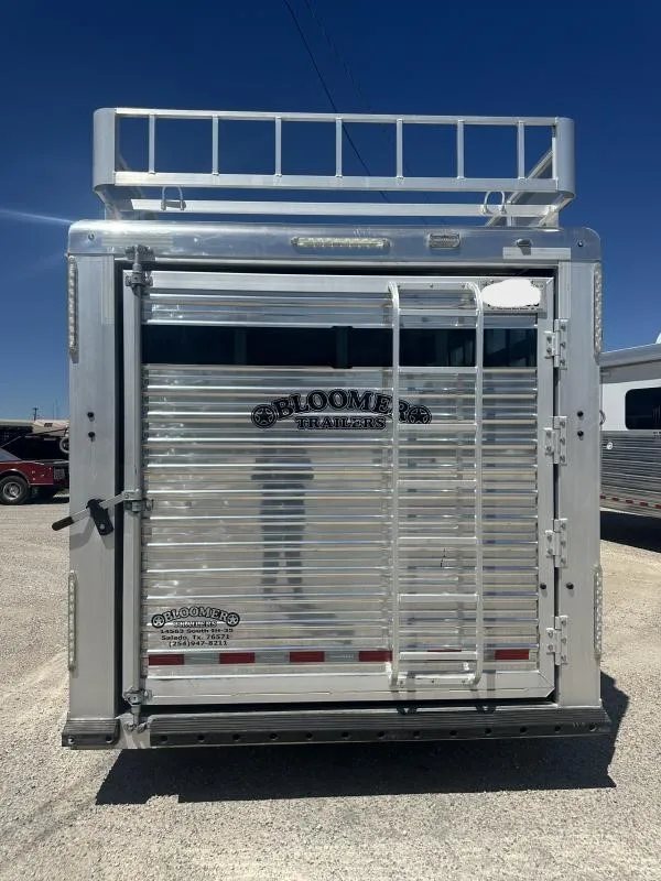 2020 Bloomer 4 Horse Stock Combo – Trainer Tack – Direct rear view of the trailer door showing ladder and dealer logo