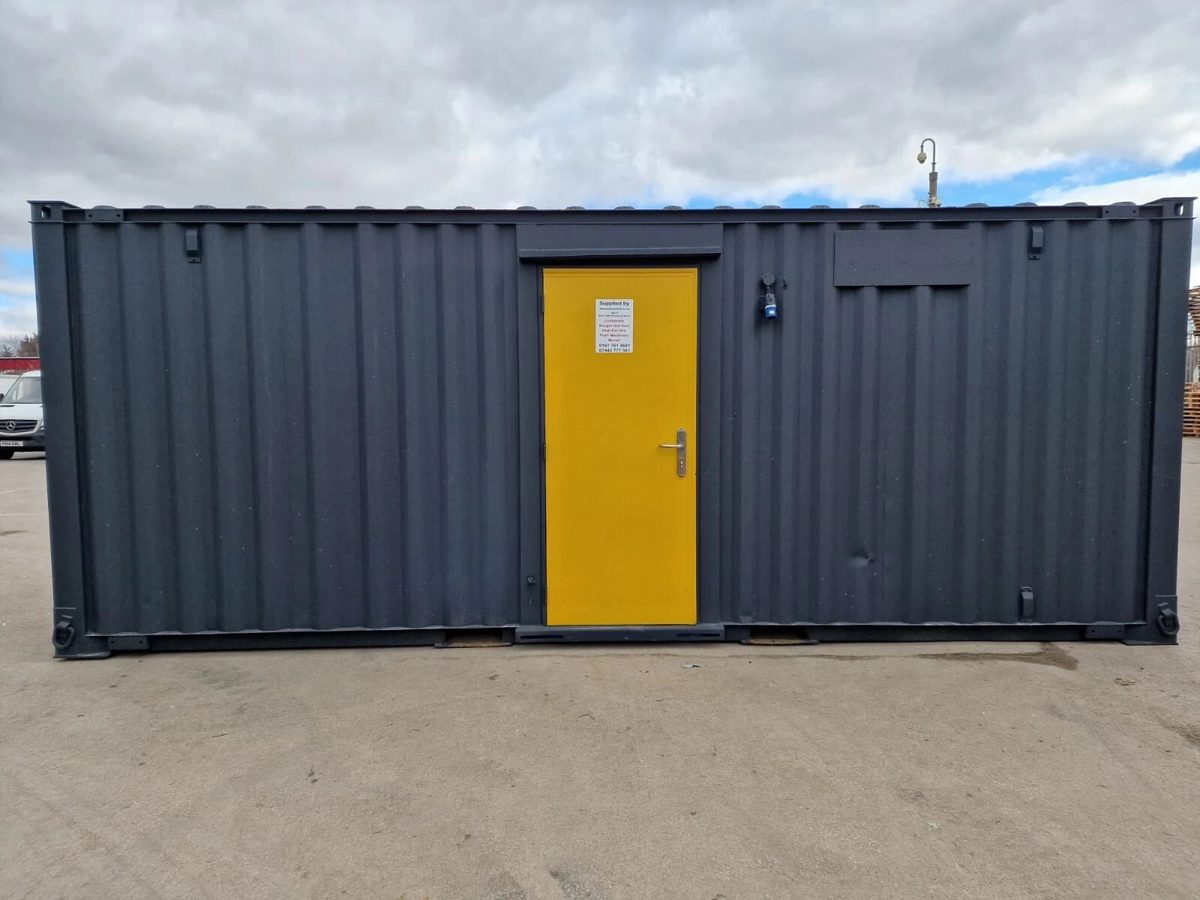 20ft Anti-Vandal Office Canteen – Insulated Steel Workspace – Front exterior of grey modular office with yellow entrance door
