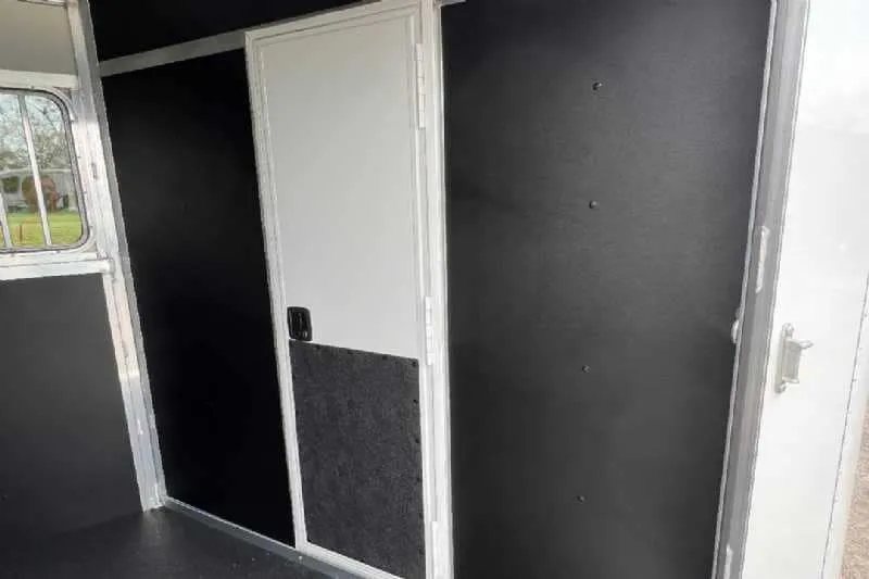 2023 Shadow 2HSSR 2 Horse Trailer – Extended Box – Black padded interior wall panels and divider door inside trailer