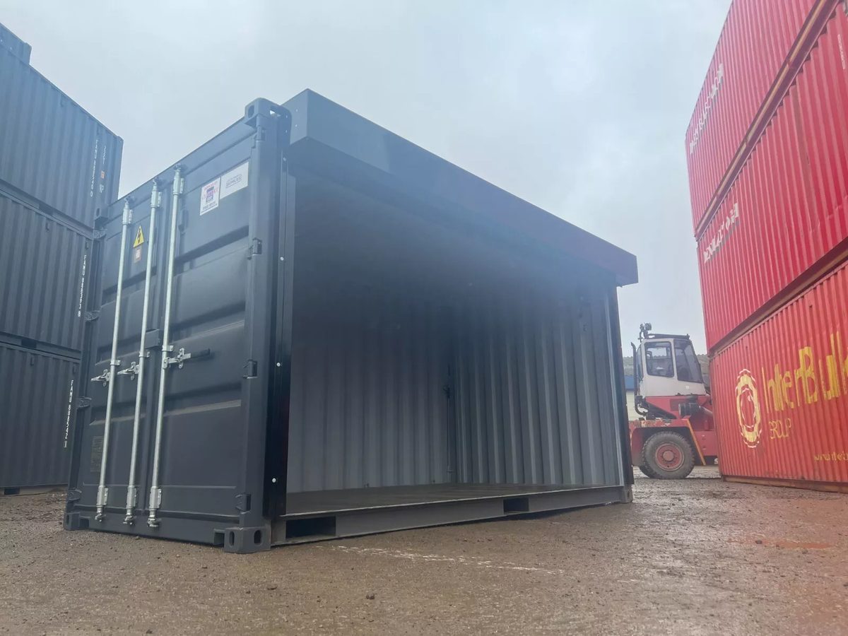 20ft One-Trip Shipping Container – Electric Roll-Up Side Door – three-quarter exterior view with full side opening raised