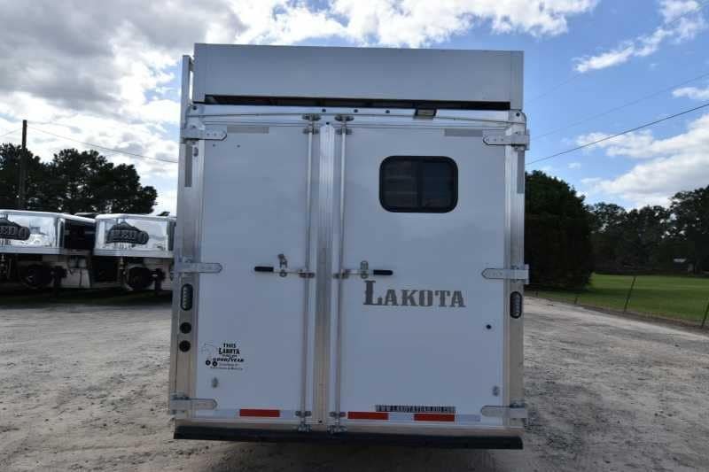 2018 Lakota 4 Horse Trailer – 2 ft Short Wall – Rear view of the trailer showing closed double doors and manufacturer decals