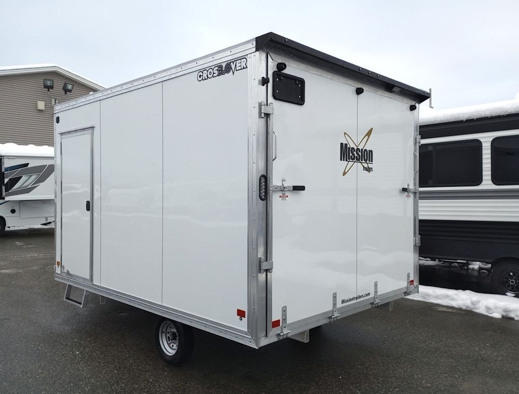 2024 Mission Trailers 12 ft Powersports – Side X Side – Rear three-quarter view of the white enclosed trailer from the passenger side