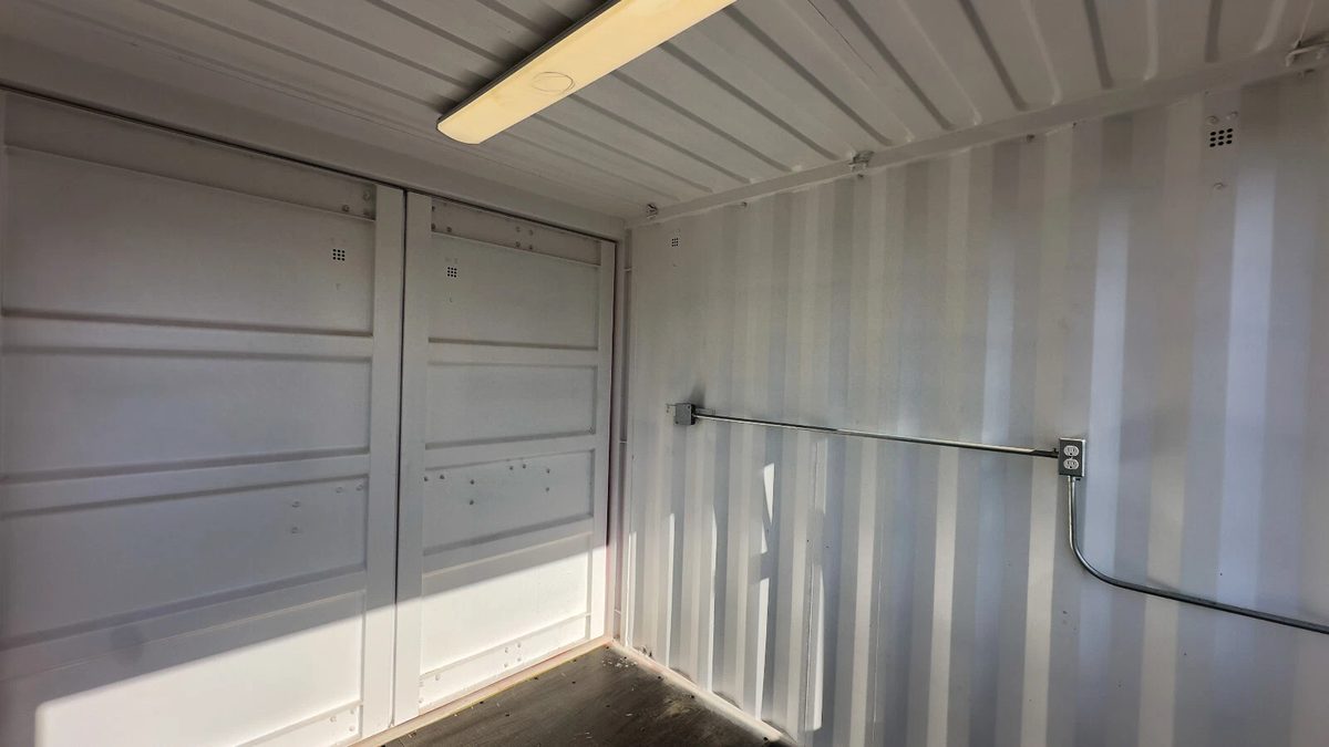 10ft Newly Built Concession Stand – Flip-Up Service Window – empty container interior with overhead light and electrical outlets