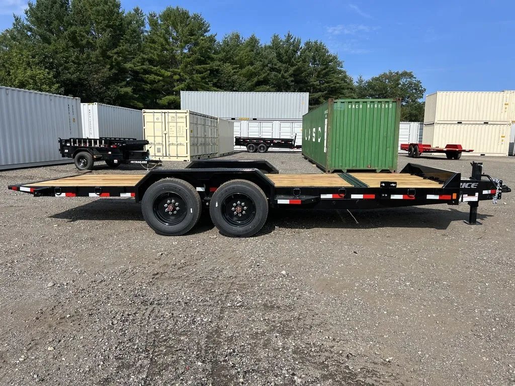 2024 Rice Trailers 20 ft Tilt Deck – Spare Mount – Full profile side view of the dual-axle equipment trailer on gravel
