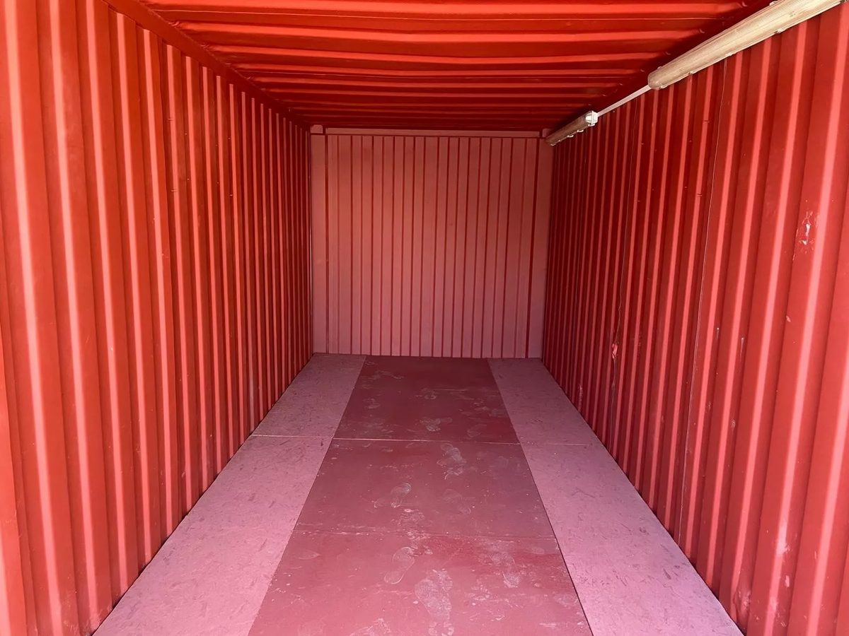 20ft Refurbished Storage Container – Anti-Vandal Doors – empty container interior with red walls and strip lighting