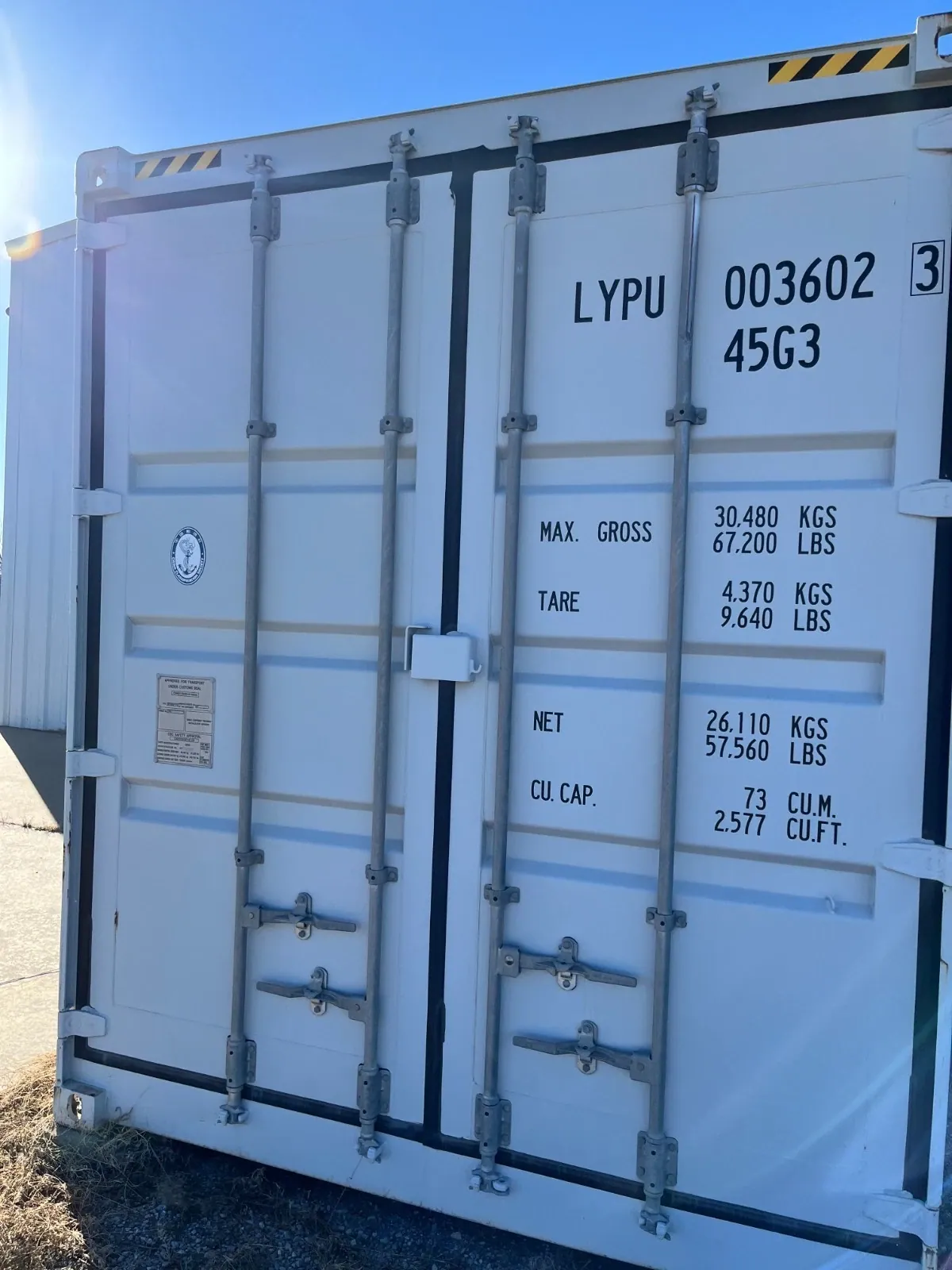 40ft High Cube Shipping Container – Side and End Doors – closed container end doors with locking bars and weight markings