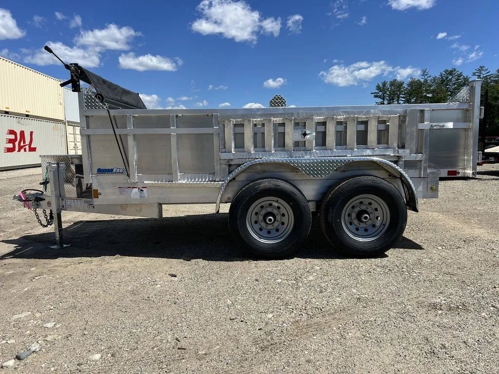 2024 Cargo Pro 12 ft Dump Trailer – Aluminum – Left side profile of the trailer showing the ribbing and fenders