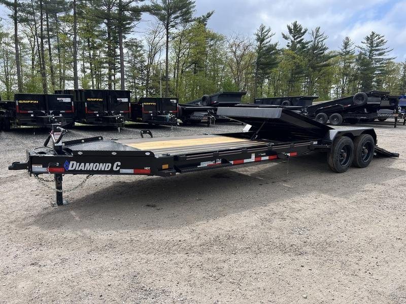 2024 Diamond C 24 ft Tilt Trailer – Spare Mount – Wide side profile of the tilt deck trailer in a lot with others