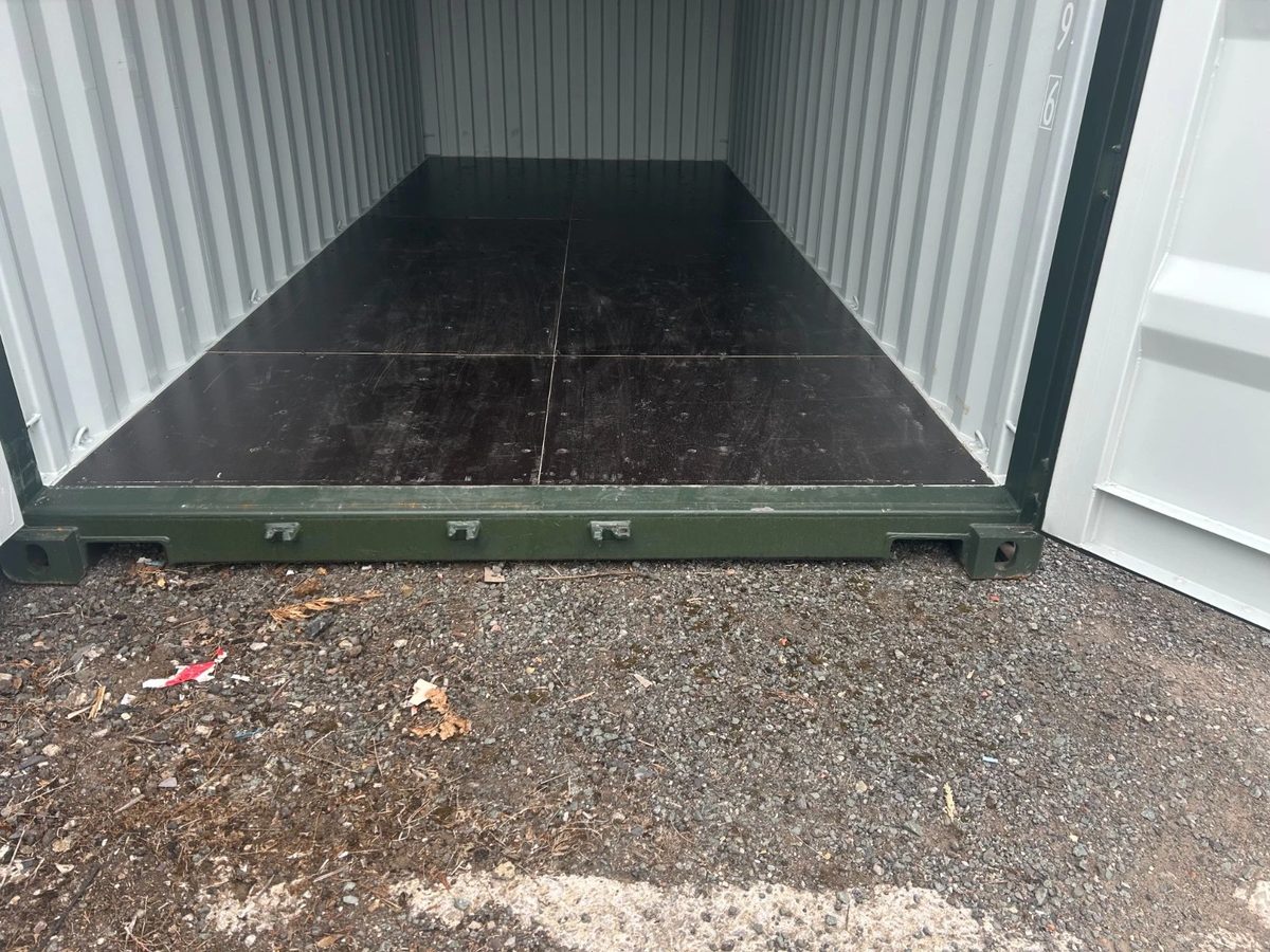 20ft New Shipping Container – One-Trip, Double Doors – empty container interior with dark flooring and open doors