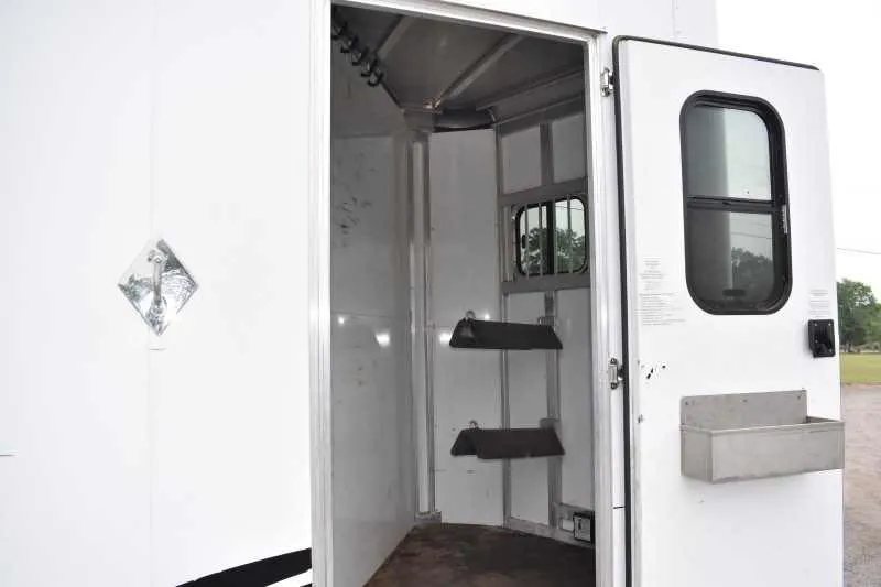 2013 Shadow 2HSL 2 Horse Trailer – Aluminum, Dressing Room – Interior view of the tack room area with saddle racks and bridle hooks