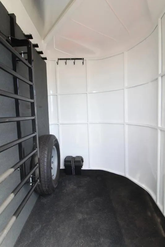 2019 Trails West 4 Horse Trailer – Convenience Package – Forward corner of the tack room showing spare tire and storage space