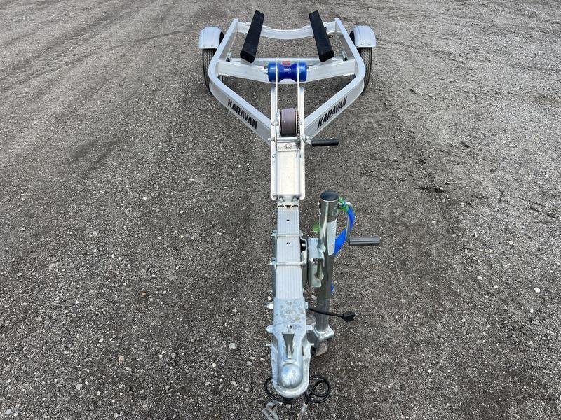 2020 Karavan Single-PWC Trailer – Aluminum, Adjustable Bunks – Front view looking down the length of the trailer towards the bunks