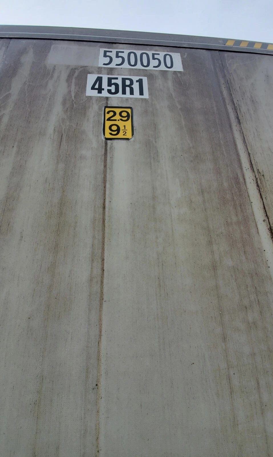 40ft As-Is Insulated Container – Electrical Connection – weathered container exterior with identification numbers and height label
