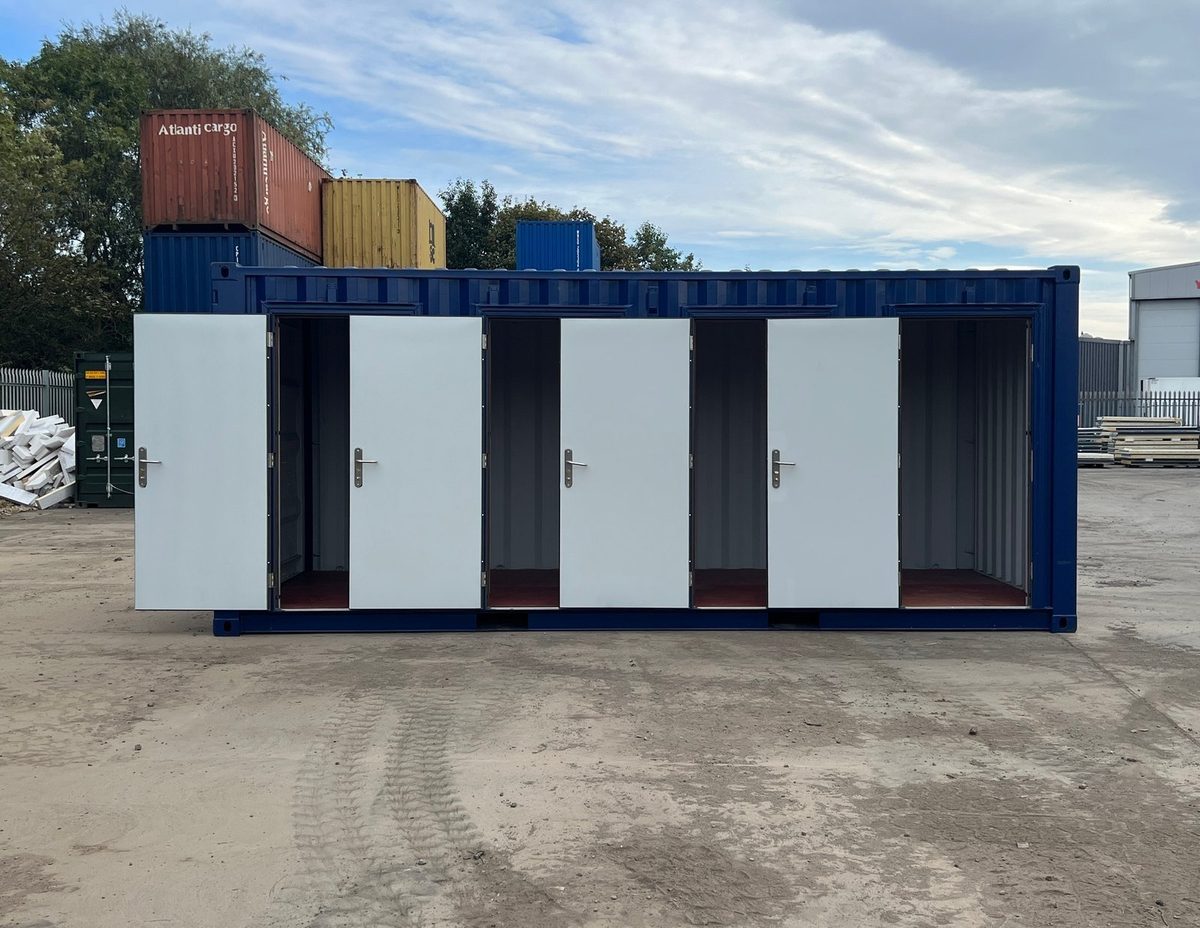 20ft New Shipping Container – Four-Door Storage Configuration – Blue storage container with four open white compartment doors