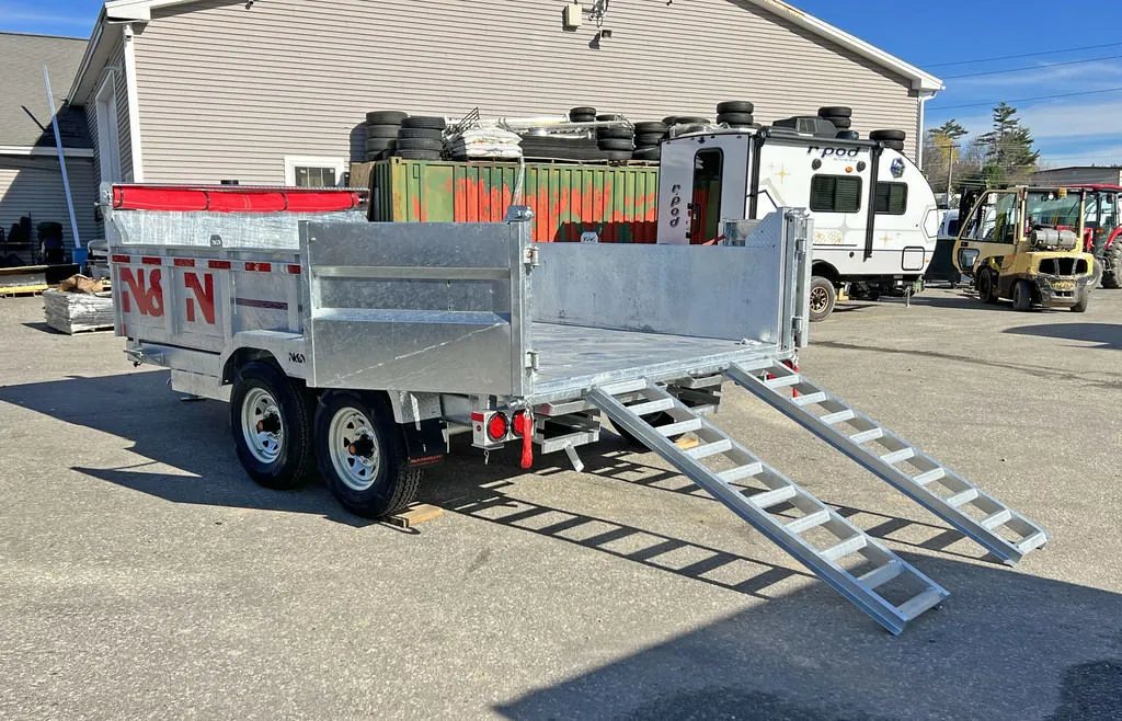 2024 N&N Trailers 14 ft Dump – Galvanized Steel – Three-quarter rear view with the ramps out and rear barn doors open