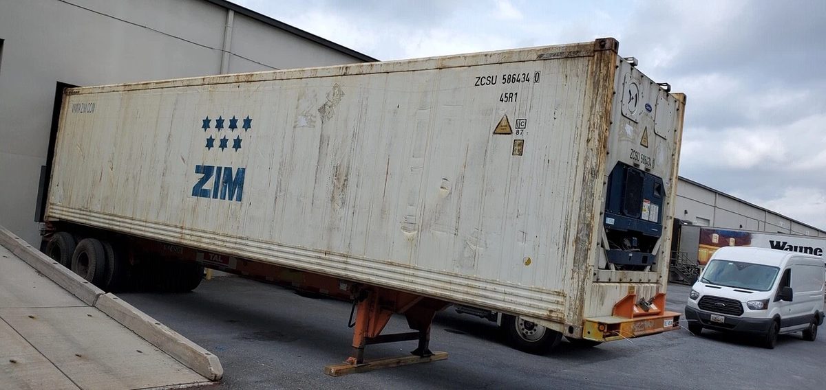 40ft High Cube Reefer Container – Non-Working, Insulated Storage – three-quarter exterior of weathered refrigerated container on trailer
