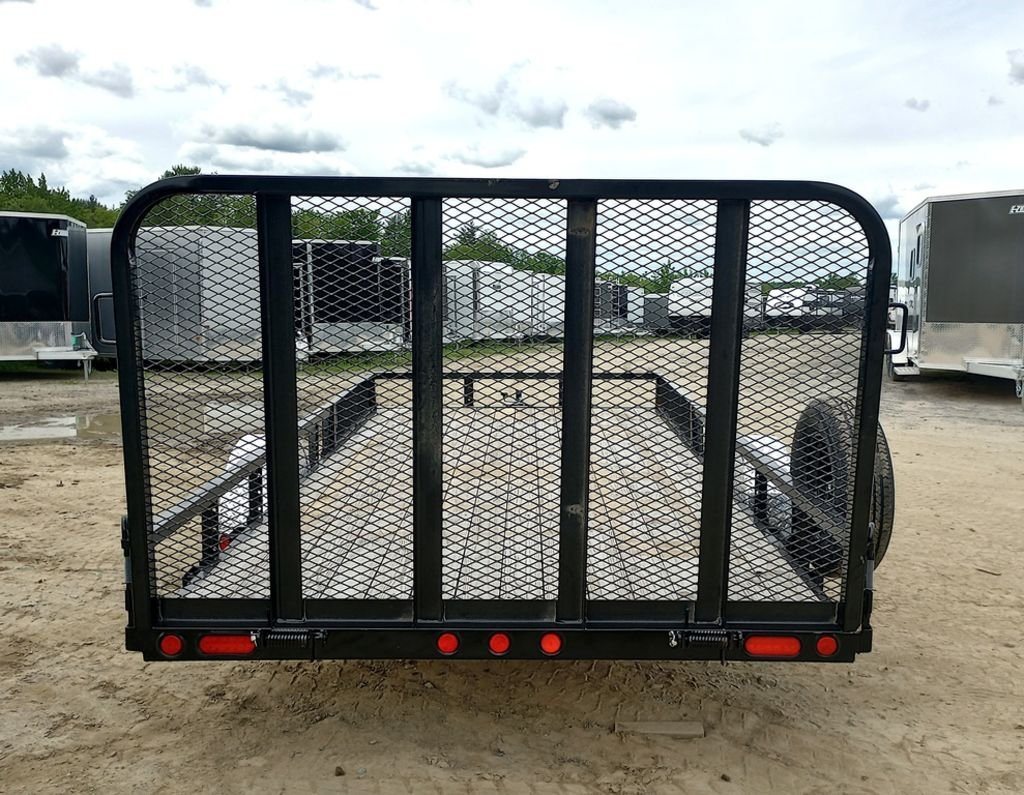 2024 PJ Trailers 14 ft Utility – Side Loading Ramps – Direct rear view of the black utility trailer with mesh ramp gate closed
