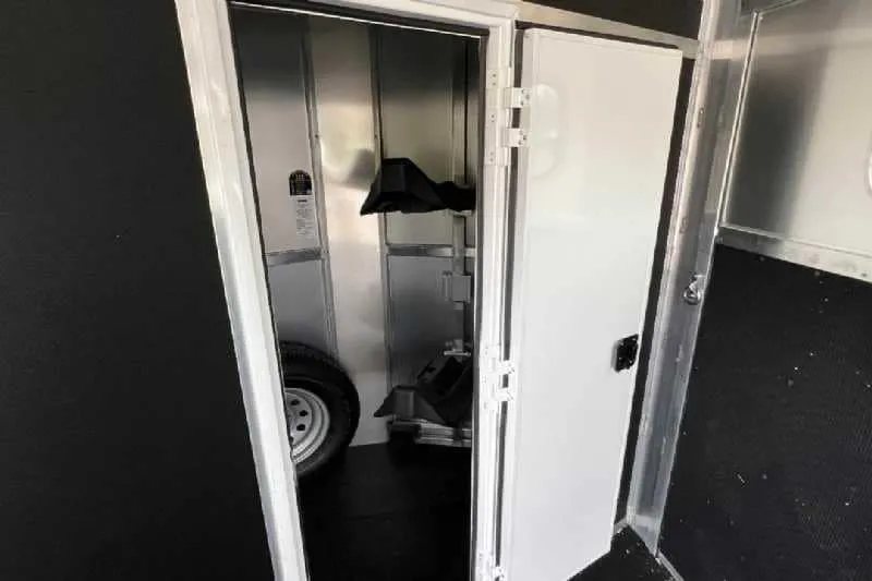 2023 Shadow 2HSSR 2 Horse Trailer – Extended Box – Interior view through door into the front tack storage area