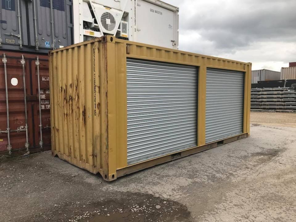 20ft Used Storage Container – Dual Side Roll-Up Doors – yellow container with two closed silver side roll-up doors