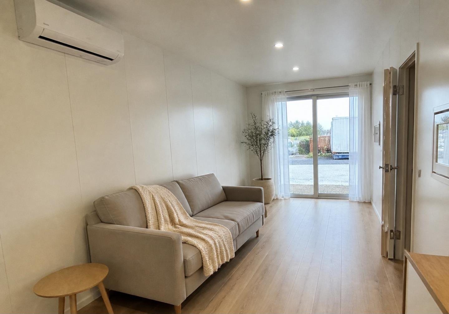 40ft Prefab Container Home – Loft & Covered Deck – Living area, reverse angle