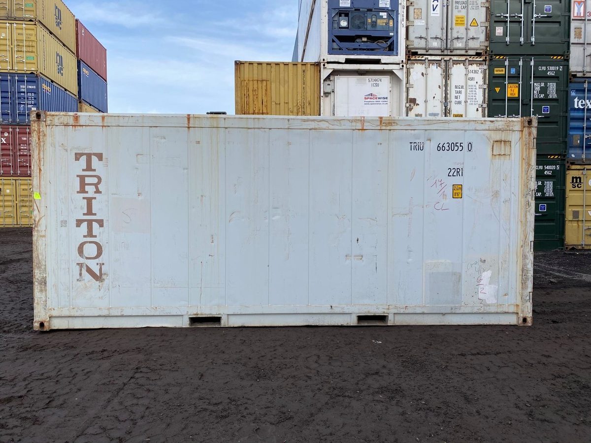 20ft Used Reefer Container – Wind & Watertight – side view of weathered refrigerated container in stacked container yard