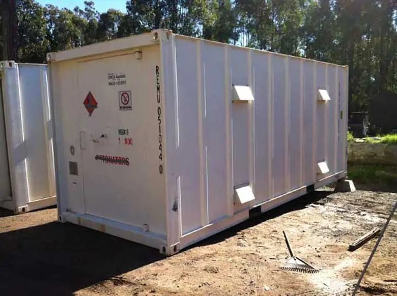 Explosive Storage Magazine – White, Insulated – Side view of a white shipping container style unit with external vent covers