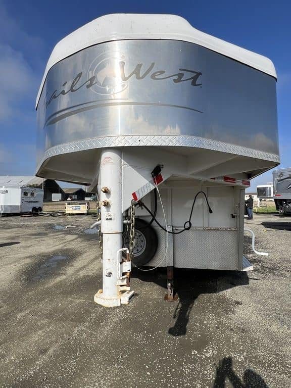 2020 Trails West Sierra 4 Horse Gooseneck – Comfort Package – Close up of the gooseneck hitch coupler and safety chains