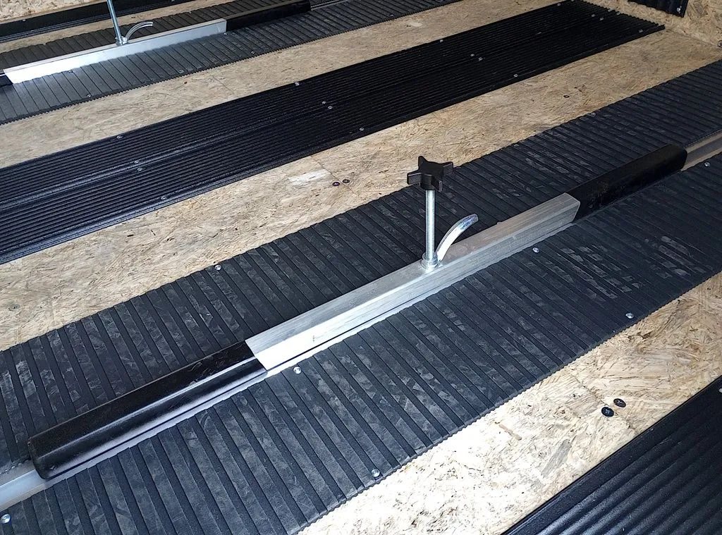 Mission Trailers Aluminum Crossover – Rear Canopy – Close-up of the interior floor showing black plastic traction mats and guides