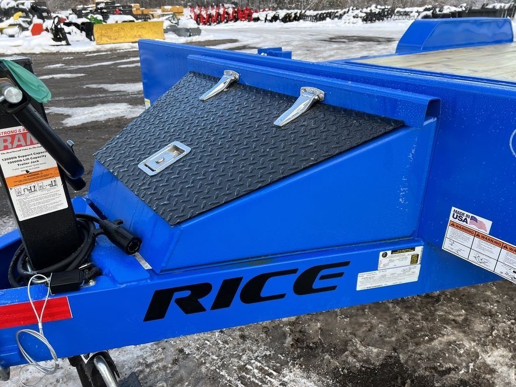 2024 Rice Trailers 20 ft Tilt Trailer – Spare Mount – Close-up of a black diamond plate toolbox mounted on the front of the blue trailer