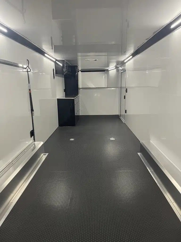 2026 ATC 44 ft Car Trailer – Aluminum Wheels – Perspective view looking down the length of a white trailer interior