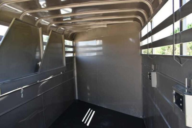 2017 CM 3HSLBP 3 Horse Trailer – Galvanneal, Dressing Room – View looking inside the horse stall area with dividers folded against the wall
