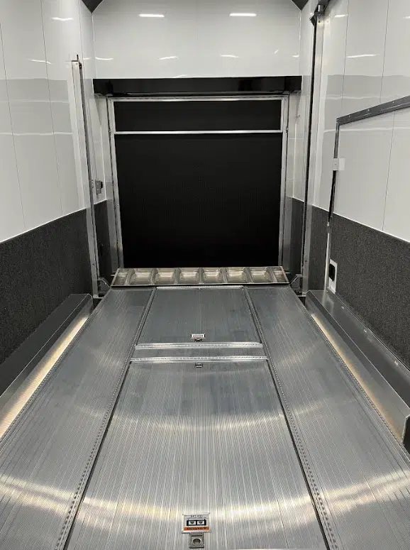 2026 ATC 22 ft Stacker – 14 ft Lift – Interior shot looking towards the closed black rear ramp door
