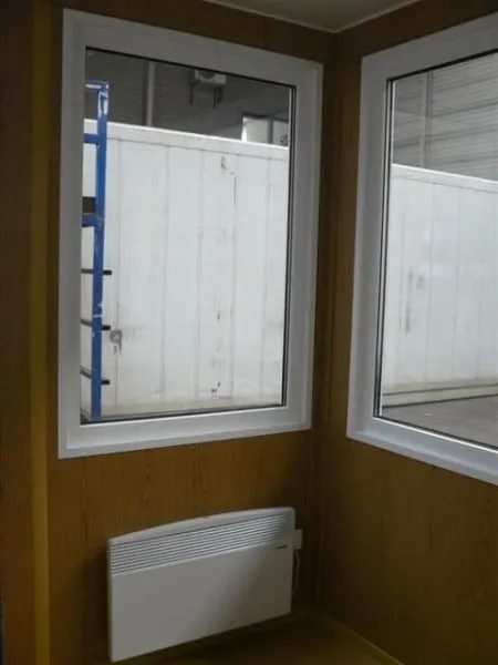10ft Steel Observation Unit – Four Fixed-Glazed Windows – empty observation unit corner with windows and wall heater