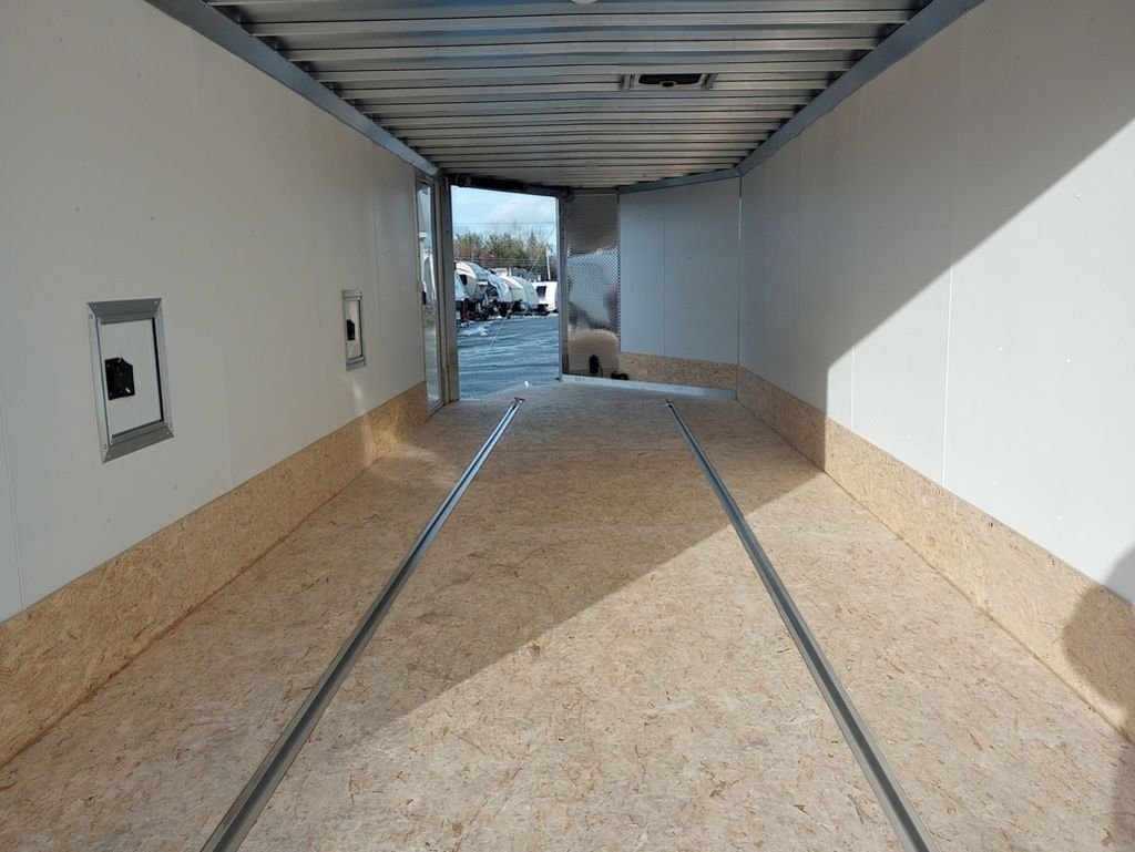 2024 Mission Trailers 24 ft Deckover – Galvanized Package – Interior view looking toward the front ramp door showing floor tracks