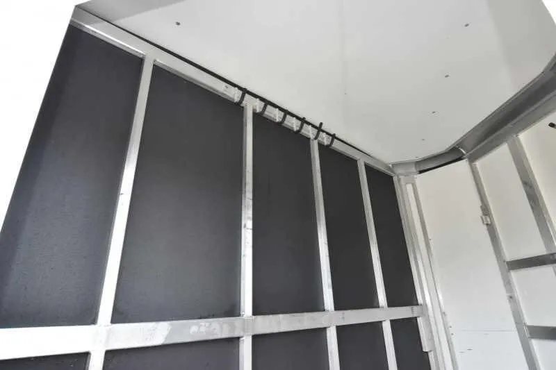 2016 Shadow 2HBP 2 Horse Bumper Pull Trailer – Aluminum – Upper corner of interior stall area showing white walls and metal frame