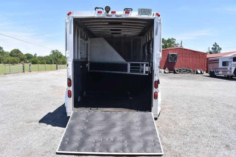 2006 Adam 7302 3 Horse Trailer – Aluminum, Dressing Room – Rear view of the trailer with the ramp lowered showing the interior