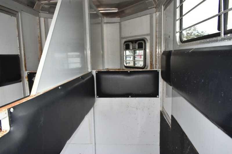 2001 CM Odyssey 2 Horse Trailer – Aluminum Floor – Inside view of the horse trailer looking toward the front stalls